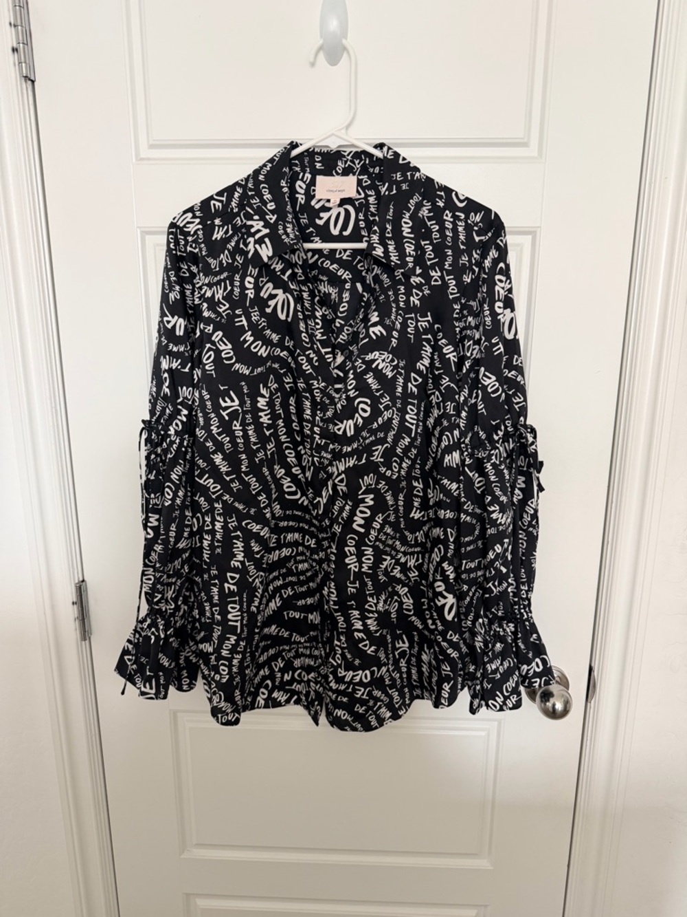 cinq a sept Black with White Script Ruffled Blouse